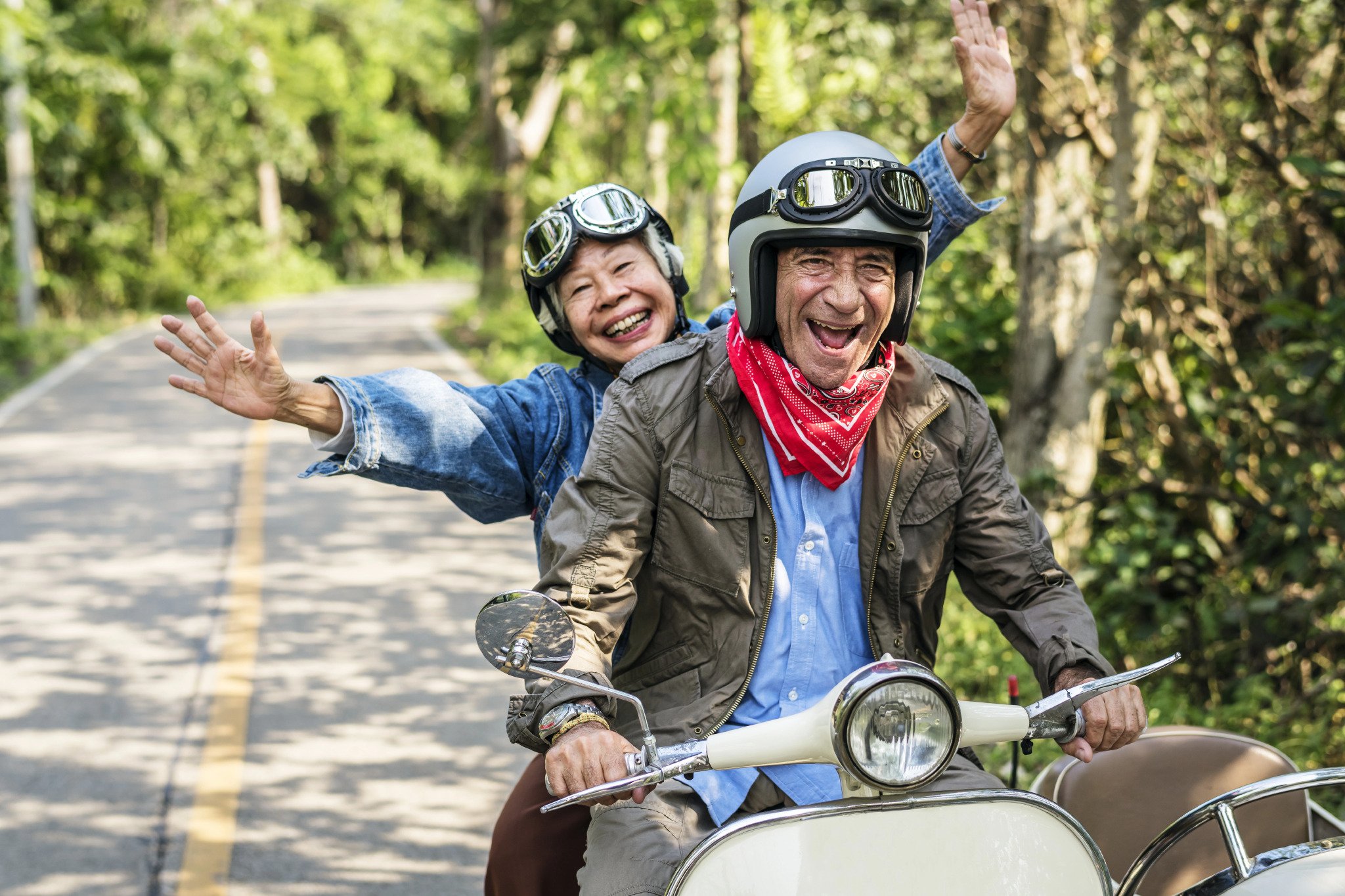 old couple riding a motorcycle