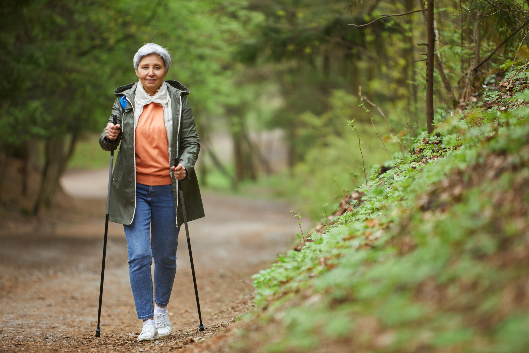 senior woman going on a walk in the woods