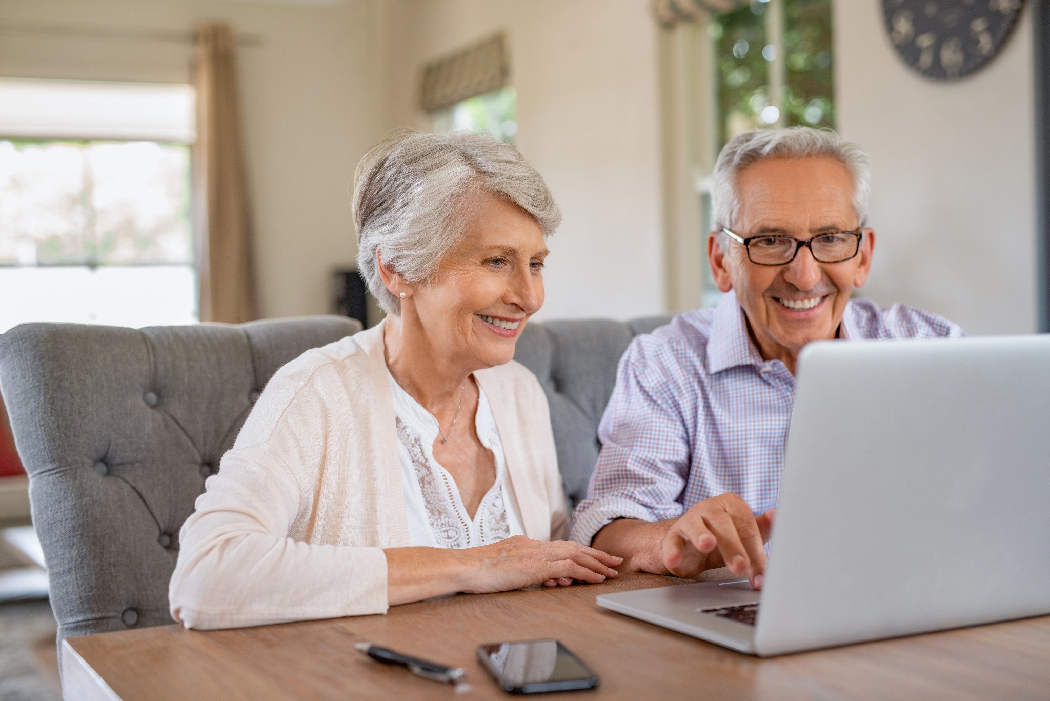senior couple using a laptop